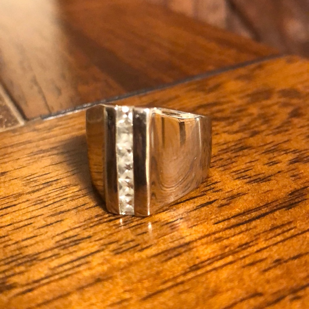 Silver ring with row of cubic zirconia